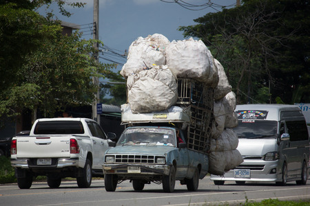 CHIANG MAI, THAILAND -SEPTEMBER 28 2017:  Over Load  Private Isuzu KB Old Pickup car. Photo at road no 121 about 8 km from downtown Chiangmai thailand.のeditorial素材