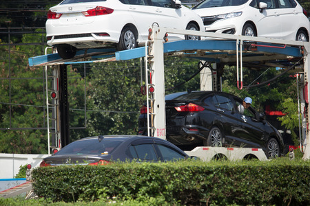 CHIANG MAI, THAILAND -OCTOBER 29 2017: ANI Logistics Group carrier trailer Truck for Honda car.   On road no.1001, 8 km from Chiangmai city.のeditorial素材