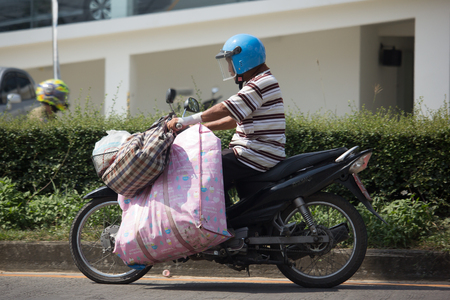 CHIANG MAI, THAILAND -NOVEMBER 21 2017: Man with Private Yamaha  Motorcycle. Photo at road no.121 about 8 km from downtown Chiangmai, thailand.のeditorial素材