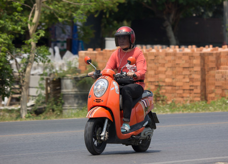 CHIANG MAI, THAILAND - APRIL  5 2018:  Private Honda Automatic Scooter Scoopy i Motorcycle. On road no.1001, 8 km from Chiangmai Business Area.のeditorial素材