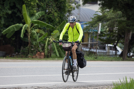 Chiangmai, Thailand - July  23 2018: Private Bicycle with old man on Highway Road.   On road no.1001, 8 km from Chiangmai city.のeditorial素材