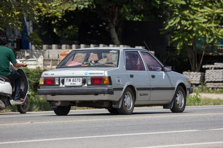 Chiangmai, Thailand - September 7 2018: Private old car Nissan Sunny. On road no.1001 8 km from Chiangmai Business Area.のeditorial素材