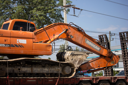 Chiangmai, Thailand - November 26 2018: Private Doosan backhoe on truck. On road no.1001, 8 km from Chiangmai city.のeditorial素材