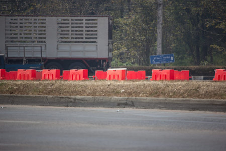 Chiangmai, Thailand - February 21 2019: Orange barrier on Construction site. Chiangmai highway road.