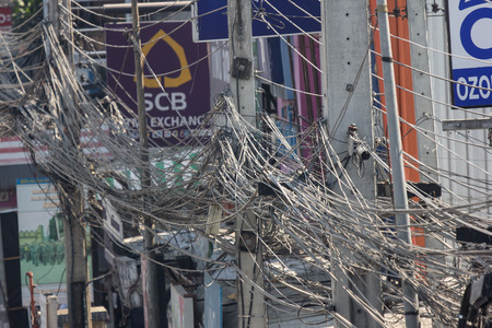 Chiangmai, Thailand - March  1 2019: Messy and Dirty cable lines on electricity power pole. Photo at Maejo City.のeditorial素材