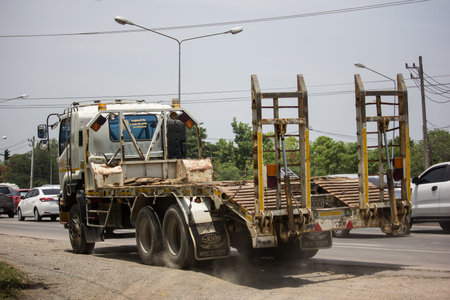 Chiangmai, Thailand - May 23 2019: Trailer Dump Truck and Backhoe  of Payawan Transport Company....