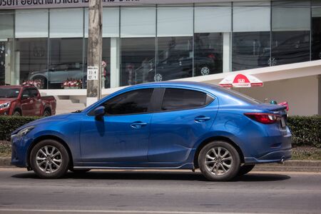 Chiangmai, Thailand - July 11 2019: Private Eco car Mazda 2. On road no.1001 8 km from Chiangmai Business Area.のeditorial素材