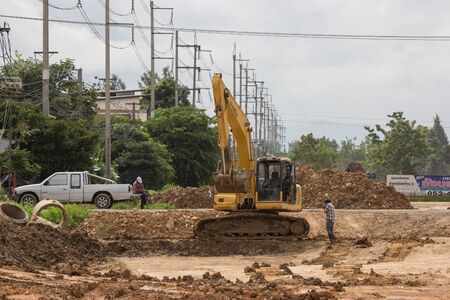Chiangmai, Thailand - August 22 2019: Private Komatsu backhoe on site construction. On road no.1001 8 km from Chiangmai city.のeditorial素材