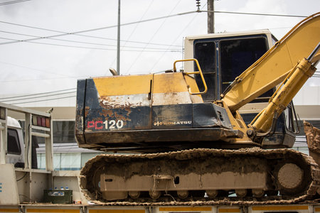 Chiangmai, Thailand - August 29 2019: Private Komatsu backhoe on truck. On road no.1001, 8 km from...
