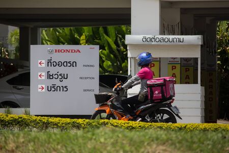 Chiangmai, Thailand - September 27 2019: Delivery service man ride a Motercycle of Food Panda. On road no.1001, 8 km from Chiangmai city.のeditorial素材