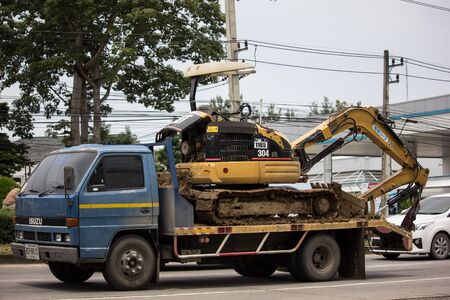 Chiangmai, Thailand - September 19 2019: Private Hitachi Cat on truck. On road no.1001, 8 km from Chiangmai city.のeditorial素材
