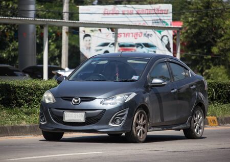 Chiangmai, Thailand -  October 8 2019: Private Eco car Mazda 2. On road no.1001 8 km from Chiangmai Business Area.のeditorial素材