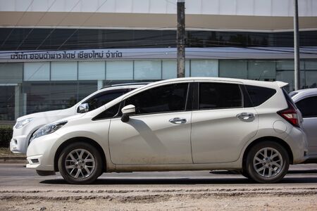 Chiangmai, Thailand - November 19 2019:  Private New Eco Car Nissan Note. On road no.1001 8 km from Chiangmai city.のeditorial素材