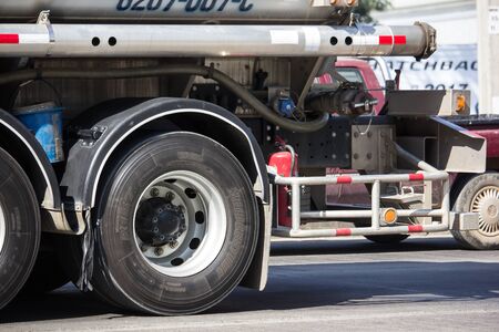 Chiangmai, Thailand - December 16 2019: Oil Truck of MeungLuang Oil transport Company. On Truck on road no.1001, 8 km from Chiangmai city.のeditorial素材