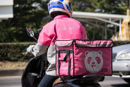Chiangmai, Thailand - December 6 2019: Delivery service man ride a Motercycle of Food Panda. On road no.1001, 8 km from Chiangmai city.のeditorial素材