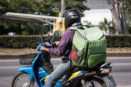 Chiangmai, Thailand - December 6 2019: Delivery service man ride a Motercycle of Grab Food. On road...