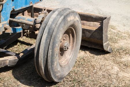 Chiangmai, Thailand - January 28 2020: Wheel of Old Ford tractor work on Construction site.のeditorial素材