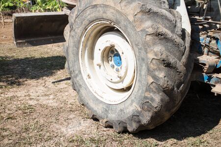 Chiangmai, Thailand - January 28 2020: Wheel of Old Ford tractor work on Construction site.のeditorial素材