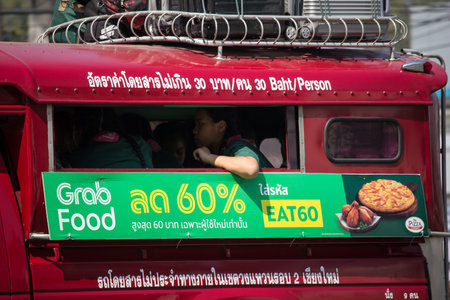 Chiangmai, Thailand - February 7 2020: Grab Food Advertise on Red taxi chiang mai. Car On road...