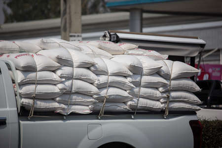 Chiangmai, Thailand - February 20 2020: Private Isuzu Dmax Pickup Truck Rice Cargo. On road no.1001 8 km from Chiangmai city.のeditorial素材