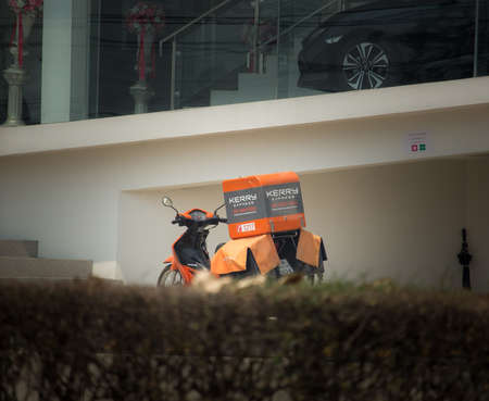 Chiangmai, Thailand -  April 3 2020: Kerry Express and Logistics Mini Container Motorcycle. Photo at road no 121 about 8 km from downtown Chiangmai, thailand.のeditorial素材