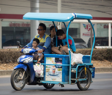 Chiangmai, Thailand - March  25 2020: Dutch Milk sale on a motorcycle.  Photo at road no 121 about 8...