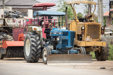 Chiangmai, Thailand -  April 14 2020:  Private Ford Tractor on Construction road. On road no.1001, 8...