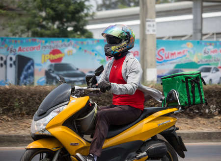 Chiangmai, Thailand -  April 14 2020: Delivery service man ride a Motercycle of Grab Food. On road no.1001, 8 km from Chiangmai city.のeditorial素材