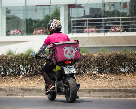 Chiangmai, Thailand -  April 21 2020: Delivery service man ride a Motercycle of Food Panda. On road no.1001, 8 km from Chiangmai city.のeditorial素材