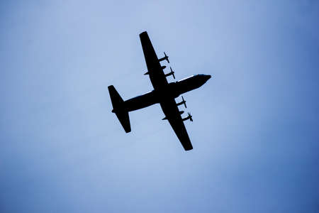 Big Military Transport Cargo Aircraft over skyの写真素材