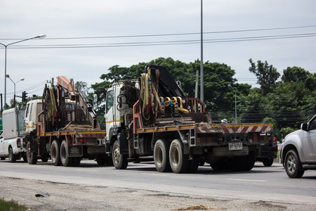 Chiangmai, Thailand -   October 10 2020:  Truck with crane of Phiboon Concrete Company. Photo at road no.121 about 8 km from downtown Chiangmai, thailand.のeditorial素材