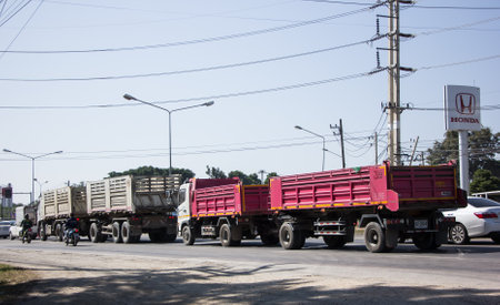 Chiangmai, Thailand -   November 30 2020:   Trailer Dump truck of Thanachai Company. On road no.1001, 8 km from Chiangmai city.のeditorial素材