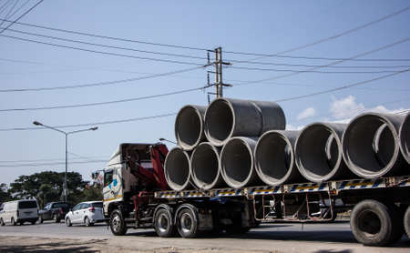 Chiangmai, Thailand - February  9 2021:  Big Truck with Crane of Piboon Concrete. On road no.1001, 8 km from Chiangmai city.のeditorial素材