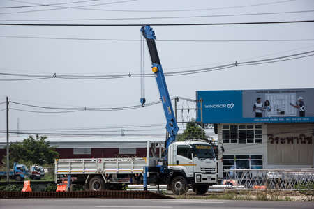 Chiangmai, Thailand - March  21 2021: Private Isuzu Truck with Unic crane. Photo at road no 121 about 8 km from downtown Chiangmai, thailand.のeditorial素材