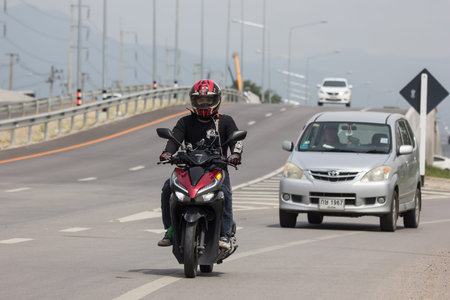 Chiangmai, Thailand - Auguest 10 2021:  Private Scooter Motorcycle, Yamaha Mio. Photo at road no.121...