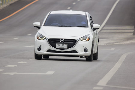 Chiangmai, Thailand - Auguest 15 2021: Private Eco car Mazda 2. On road no.1001 8 km from Chiangmai...