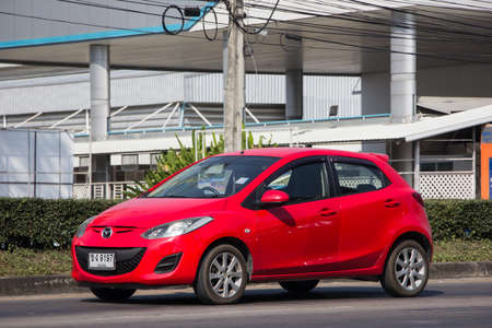 Chiangmai, Thailand - December 24 2021: Private Eco car Mazda 2. On road no.1001 8 km from Chiangmai Business Area.のeditorial素材