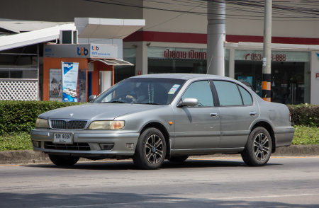 Chiangmai, Thailand - April  22 2022: Private car, Nissan Cefiro. On road no.1001, 8 km from Chiangmai city.のeditorial素材