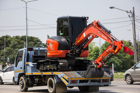 Chiangmai, Thailand - April  21 2022: Private Kubota backhoe on truck. On road no.1001, 8 km from Chiangmai city.のeditorial素材