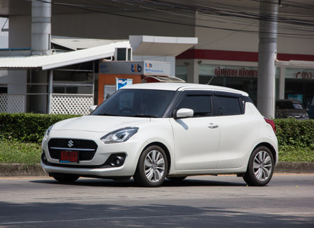 Chiangmai, Thailand - April  21 2022: Private Eco city Car New Suzuki Swift. Photo at road no.121 about 8 km from downtown Chiangmai, thailand.のeditorial素材