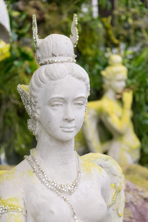 Kinnari statue in the forests of Thailand