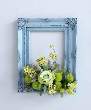 Frame with blue flowers on a white backgroundの写真素材