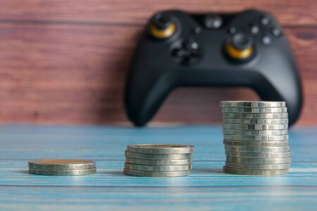 Thailand coins are arranged in 3 groups and have a joystick behind.の写真素材