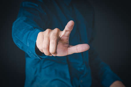 The man shows the gesture of pointing touching on the virtual screen and has a beehive screen effect.  Investment ideas, business concepts, technology concepts.の写真素材