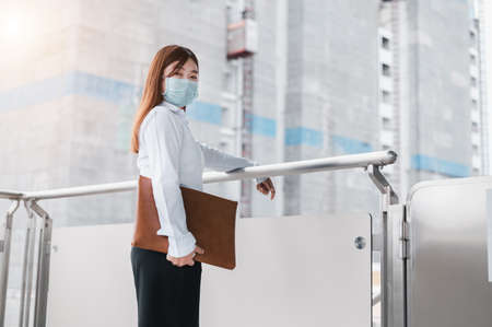 Female engineer inspecting building construction. Unemployed young women holding a job application.  Unemployment concept, Business idea. Engineer concept, Construction concept.の写真素材