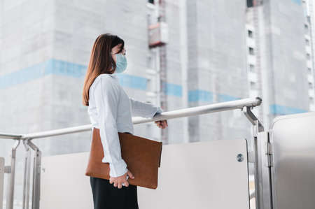 Female engineer inspecting building construction. Unemployed young women holding a job application.  Unemployment concept, Business idea. Engineer concept, Construction concept.の写真素材