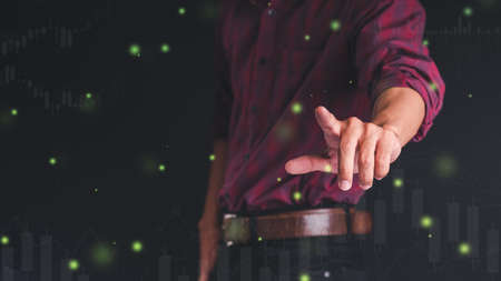 Businessmen use the index finger to touch the icon for future web technology icons that work in digital charts, business strategy concepts, Business man concepts, technology conceptsの写真素材