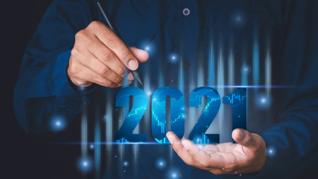 Stock market data candles stacked with 2021 numbers. Indicators of the rising stocks on the background of high-tech technology finance. technology communication concept.の写真素材
