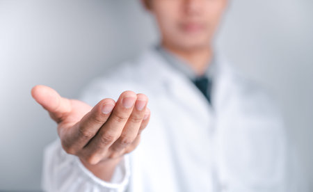 Doctor or scientist carries a syringe and a vaccineの写真素材