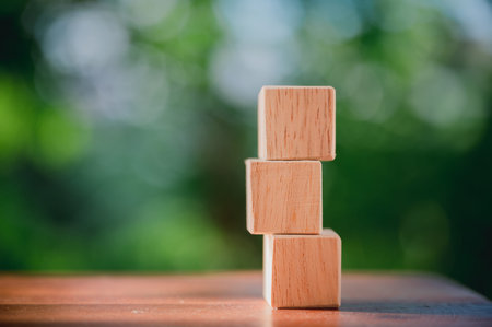Wood block is arrange row put up on the table show concepts and strategy of business with natural green background.の写真素材